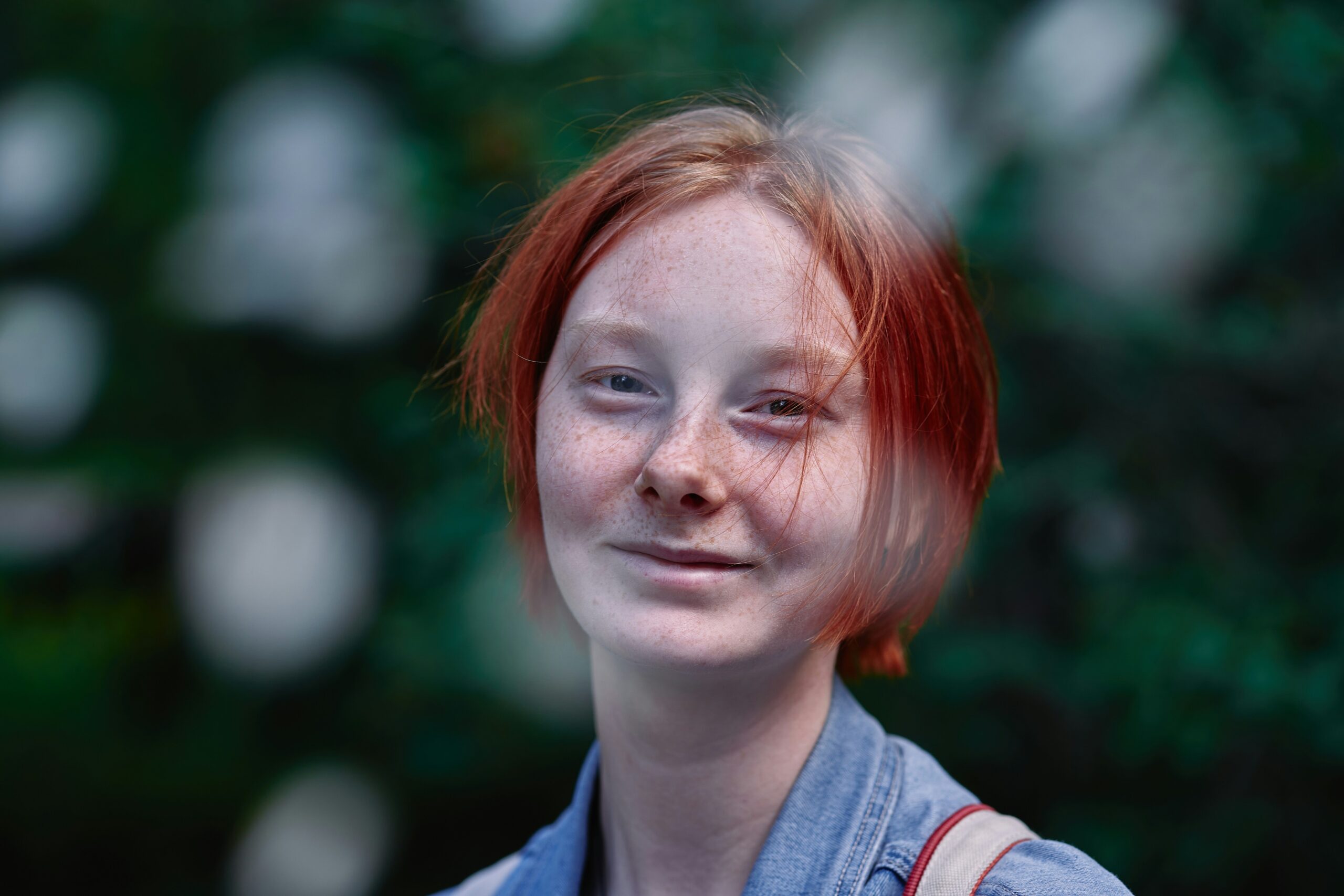 Testimonial image showing Jenny smiling with before-and-after weight loss comparison