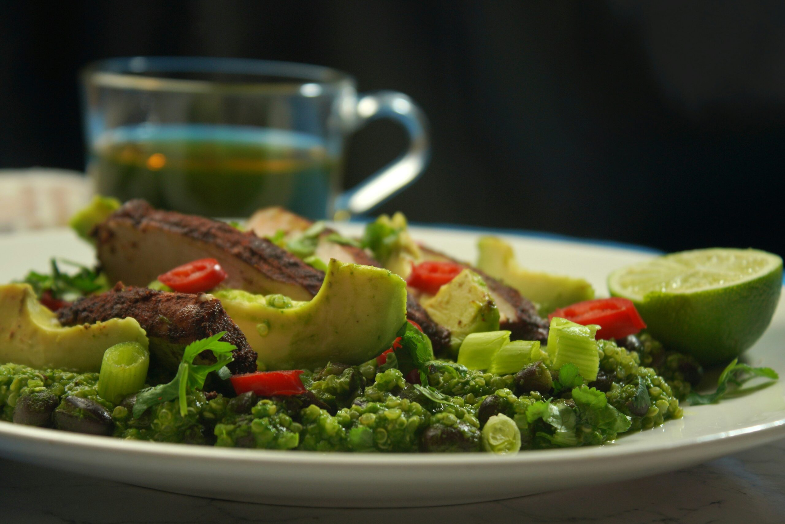 A vibrant wellness plate featuring lean protein, quinoa, and colorful veggies